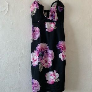 Tight long dress with plunging chest line.